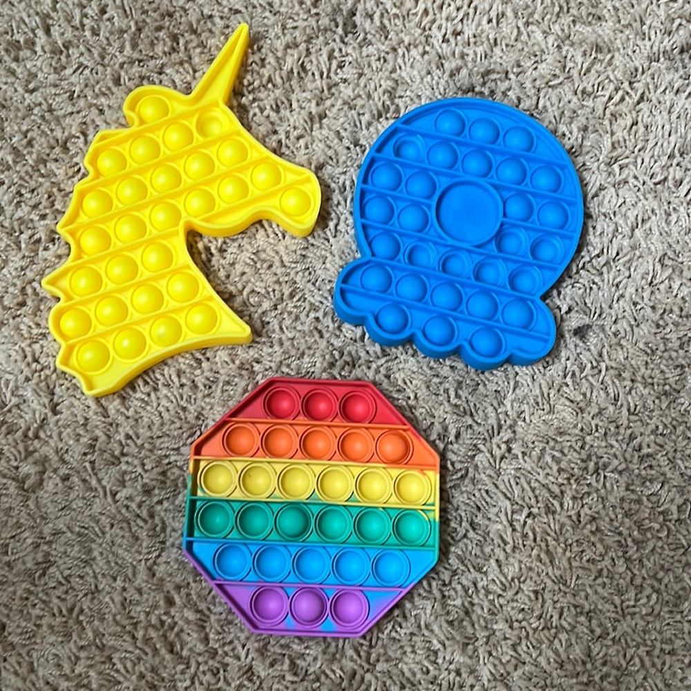Pop-its kids fidget toy. Set of three, blue, yellow and multi color